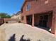 The home has a paved patio, a covered porch, and an adjacent yard at 5419 Brass Hills Ct, Las Vegas, NV 89122