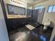 Bathroom featuring double vanity, with framed mirror, and a modern tiled shower at 5419 Brass Hills Ct, Las Vegas, NV 89122