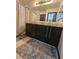 Bathroom showcasing a double sink vanity with granite counters, and a framed mirror at 5419 Brass Hills Ct, Las Vegas, NV 89122