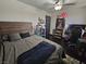 Bedroom with dark wood floors, neutral walls, a bed, and shelves filled with toys at 5419 Brass Hills Ct, Las Vegas, NV 89122