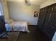 Bedroom with dark hardwood floors, neutral walls, closet, and ceiling fan at 5419 Brass Hills Ct, Las Vegas, NV 89122