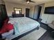 Spacious bedroom with a ceiling fan, a television, and dark wood furnishings at 5419 Brass Hills Ct, Las Vegas, NV 89122