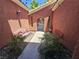 Inviting courtyard with benches, landscaping, a metal gate, and string lights overhead at 5419 Brass Hills Ct, Las Vegas, NV 89122