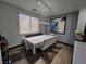 Dining area featuring modern chandelier, table with six chairs, and an abstract painting on the wall at 5419 Brass Hills Ct, Las Vegas, NV 89122