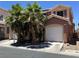 Inviting two-story home with two-car garage and desert landscaping at 5419 Brass Hills Ct, Las Vegas, NV 89122
