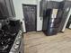 Modern kitchen with dark cabinets, stainless steel appliances, granite countertops, and stylish tile flooring at 5419 Brass Hills Ct, Las Vegas, NV 89122