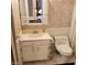 Bathroom features a single vanity with storage, toilet, and floral wallpaper at 5841 Medallion Dr # 102, Las Vegas, NV 89122