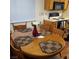 Cozy dining area featuring a round wooden table with four chairs at 5841 Medallion Dr # 102, Las Vegas, NV 89122