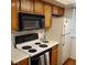 Kitchen with basic appliances and cabinets at 5841 Medallion Dr # 102, Las Vegas, NV 89122