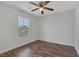 This bedroom features wood floors and a ceiling fan at 589 Brinkburn Point Ave, Las Vegas, NV 89178