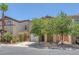 Charming home featuring desert landscaping, a two-car garage, and neutral-toned exterior at 589 Brinkburn Point Ave, Las Vegas, NV 89178