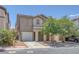 Charming home featuring desert landscaping, a two-car garage, and neutral-toned exterior at 589 Brinkburn Point Ave, Las Vegas, NV 89178