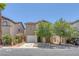 Charming home featuring desert landscaping, a two-car garage, and neutral-toned exterior at 589 Brinkburn Point Ave, Las Vegas, NV 89178