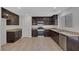 Modern kitchen featuring recessed lighting, stainless steel appliances, and tile flooring at 589 Brinkburn Point Ave, Las Vegas, NV 89178