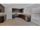 Modern kitchen featuring recessed lighting, stainless steel appliances, and tile flooring at 589 Brinkburn Point Ave, Las Vegas, NV 89178