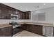 Bright kitchen featuring stainless steel appliances and plenty of cabinet space at 589 Brinkburn Point Ave, Las Vegas, NV 89178