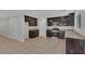 Spacious kitchen with stainless steel appliances and dark wood cabinetry at 589 Brinkburn Point Ave, Las Vegas, NV 89178