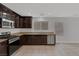 Open kitchen with stainless steel appliances and bright natural lighting at 589 Brinkburn Point Ave, Las Vegas, NV 89178