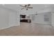 Open concept living room featuring tile flooring, recessed lighting, and access to kitchen at 589 Brinkburn Point Ave, Las Vegas, NV 89178