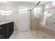 Modern bathroom featuring a glass-enclosed shower and vanity at 6056 Atlantis Dream Ave, Las Vegas, NV 89139