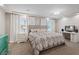 Relaxing bedroom with a tufted headboard, dresser and soft lighting at 6056 Atlantis Dream Ave, Las Vegas, NV 89139