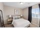 Stylishly furnished bedroom with neutral walls, a comfortable bed, and contemporary décor at 6056 Atlantis Dream Ave, Las Vegas, NV 89139