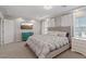 Comfortable bedroom featuring a large bed, neutral colors, and plenty of natural light at 6056 Atlantis Dream Ave, Las Vegas, NV 89139