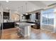 Stylish kitchen featuring sleek cabinetry, granite countertops, stainless steel appliances, and center island at 6056 Atlantis Dream Ave, Las Vegas, NV 89139