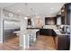 Gourmet kitchen boasts stainless steel appliances, granite countertops, and center island with seating at 6056 Atlantis Dream Ave, Las Vegas, NV 89139