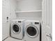 Well-lit laundry room featuring side-by-side washer and dryer at 6056 Atlantis Dream Ave, Las Vegas, NV 89139