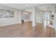 Spacious living room boasting hardwood floors, natural light, and ample space for entertaining at 6056 Atlantis Dream Ave, Las Vegas, NV 89139