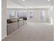 Open-concept living area with comfortable seating, large windows, and ample natural light at 6056 Atlantis Dream Ave, Las Vegas, NV 89139