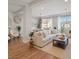 Comfortable living room featuring a plush sectional, stylish decor, and plenty of natural light at 6056 Atlantis Dream Ave, Las Vegas, NV 89139