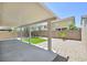 The covered patio enhances this backyard with gravel and artificial turf, a great outdoor living space at 6133 Roseboro Ct, North Las Vegas, NV 89081