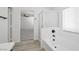 Bright bathroom showcasing a tub, shower, and seamless access to bedroom and carpeted areas at 6133 Roseboro Ct, North Las Vegas, NV 89081