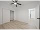 Bedroom featuring wood-look floors, neutral walls, and closet with sliding doors at 6133 Roseboro Ct, North Las Vegas, NV 89081