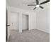 Bedroom featuring carpeted floors, a ceiling fan, and an open closet at 6133 Roseboro Ct, North Las Vegas, NV 89081