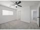 Bedroom featuring carpeted floors, a ceiling fan, and an open closet at 6133 Roseboro Ct, North Las Vegas, NV 89081