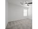 Bedroom featuring a ceiling fan, neutral paint, and plush gray carpeting at 6133 Roseboro Ct, North Las Vegas, NV 89081