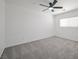 Bedroom featuring carpeted floors, a ceiling fan, and a window with blinds at 6133 Roseboro Ct, North Las Vegas, NV 89081