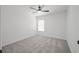 Bedroom featuring carpeted floors, a ceiling fan, and a window with blinds at 6133 Roseboro Ct, North Las Vegas, NV 89081