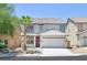 Charming two-story home with a well-maintained front yard, palm tree, and attached two-car garage at 6133 Roseboro Ct, North Las Vegas, NV 89081