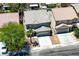 Nevada home aerial showcasing a two-story residence, desert landscaping, and attached two-car garage at 6133 Roseboro Ct, North Las Vegas, NV 89081
