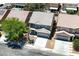 Street-view aerial of a two-story home featuring an attached garage and desert landscaping at 6133 Roseboro Ct, North Las Vegas, NV 89081
