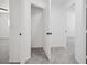 Hallway showing access to various rooms and featuring neutral paint and carpeting at 6133 Roseboro Ct, North Las Vegas, NV 89081