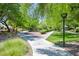 A landscaped park setting features shade trees, green grass and walking paths at 6133 Roseboro Ct, North Las Vegas, NV 89081