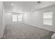 Spacious carpeted loft with neutral walls and natural light at 6133 Roseboro Ct, North Las Vegas, NV 89081