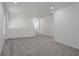 Bright and airy loft space featuring plush gray carpeting and neutral walls, perfect for flexible living at 6133 Roseboro Ct, North Las Vegas, NV 89081