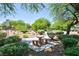 Park with lush green landscape, shaded picnic benches, and mature trees, perfect for relaxation at 6133 Roseboro Ct, North Las Vegas, NV 89081