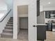 Storage space under the staircase with carpet at 6133 Roseboro Ct, North Las Vegas, NV 89081
